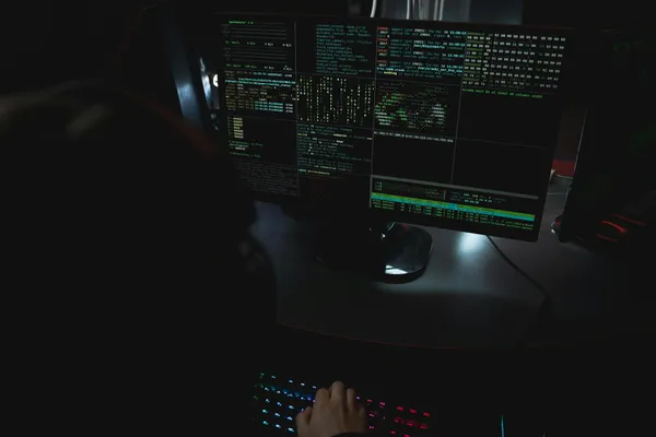 Dark developer workstation with code on monitors representing AI coding configuration