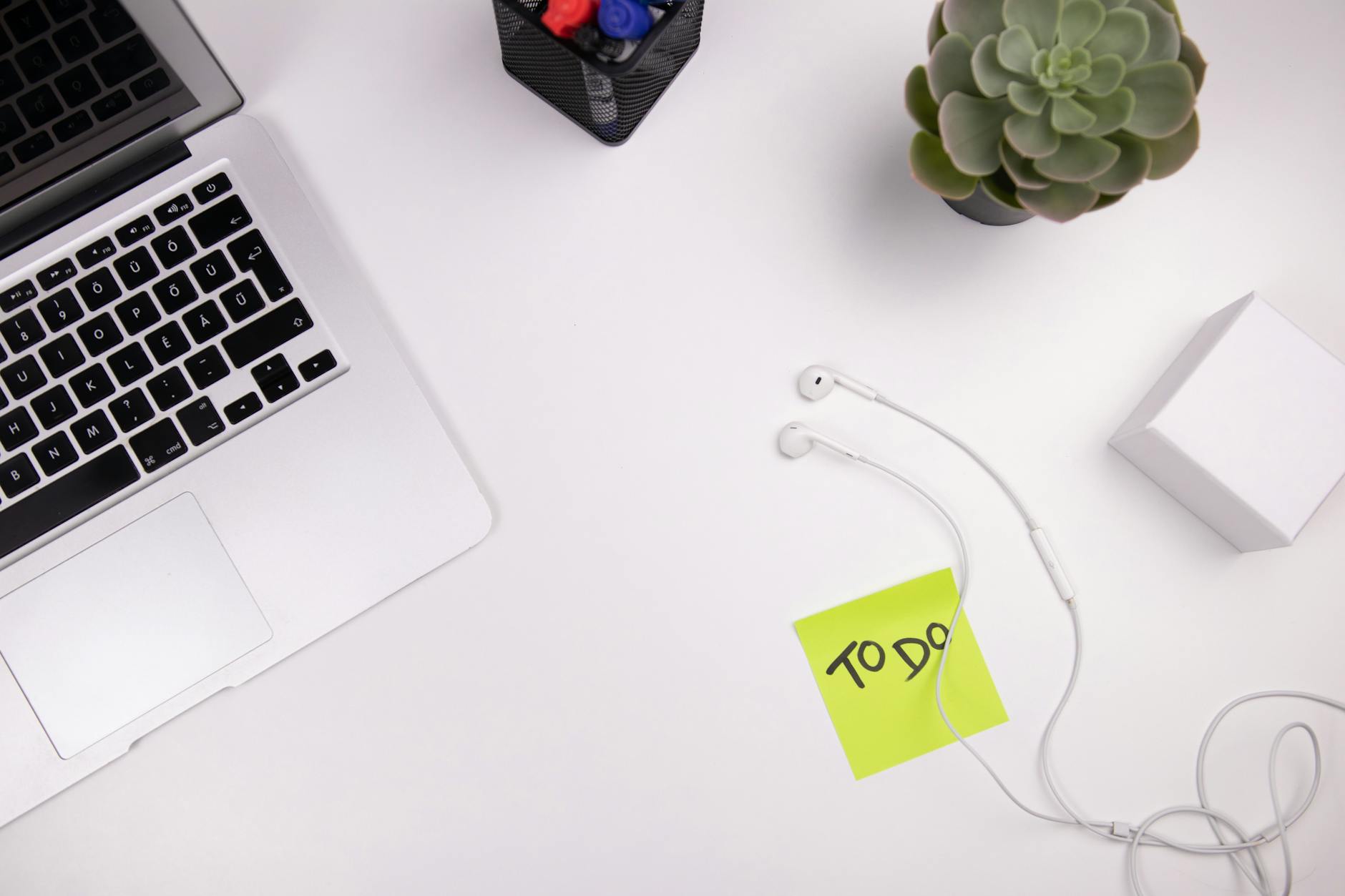Developer productivity setup with laptop and workflow tools on a clean desk